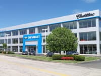 MacMulkin Chevrolet Cadillac Corvette logo